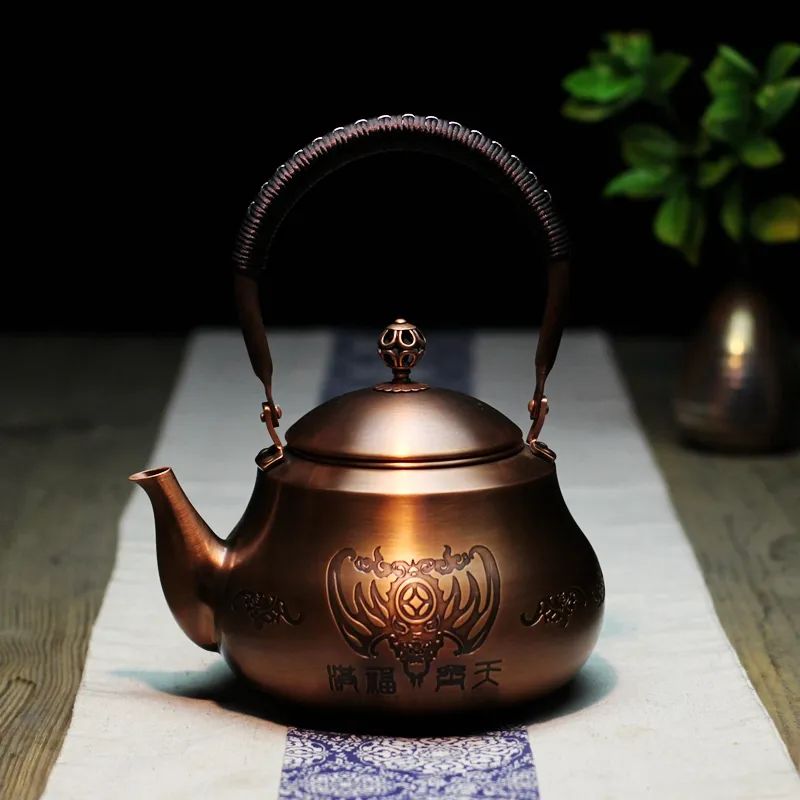 Hand Woven Lifting Beam Pear Shaped Copper Teapot